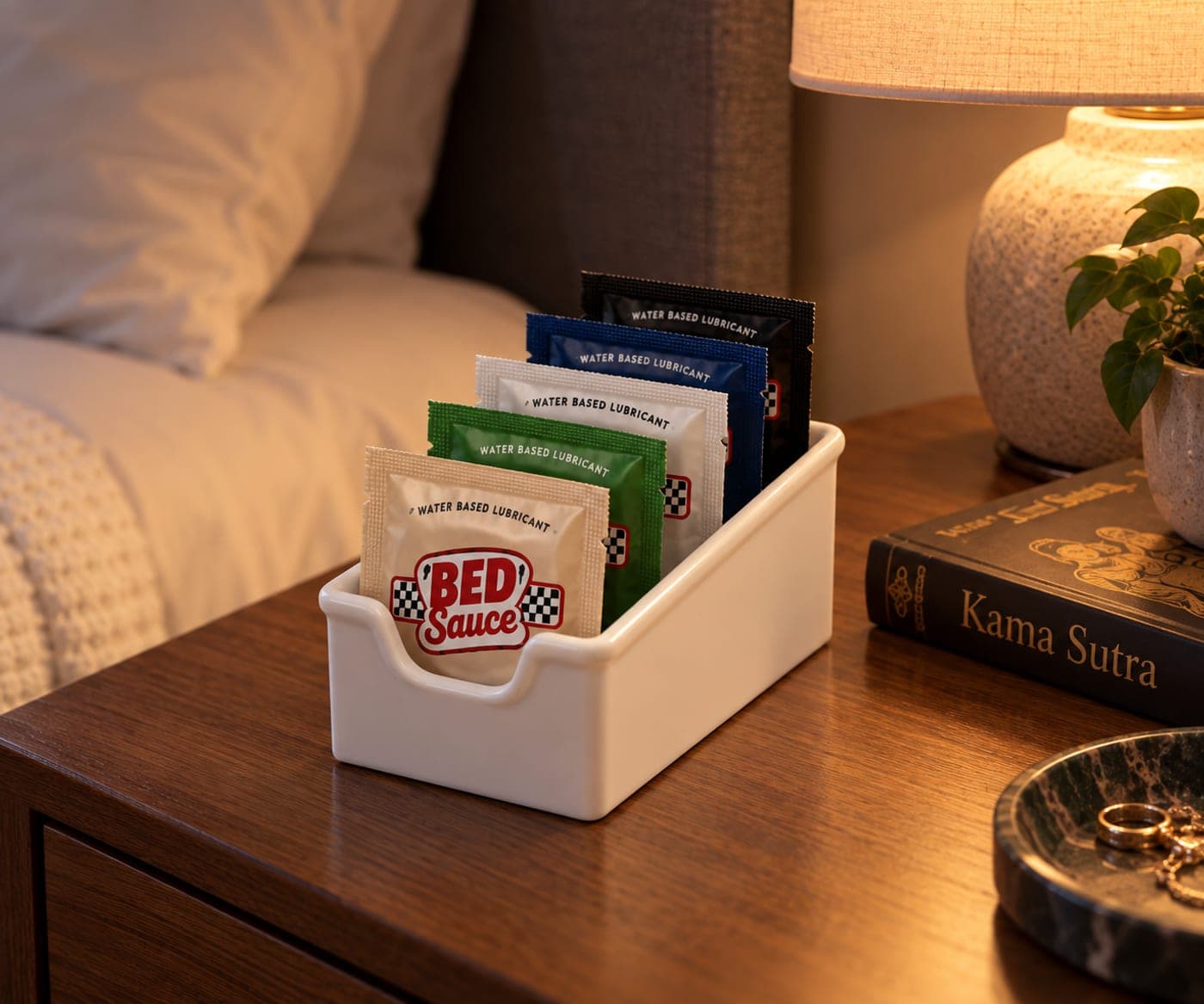 A Bed Sauce caddy of packets on a nightstand